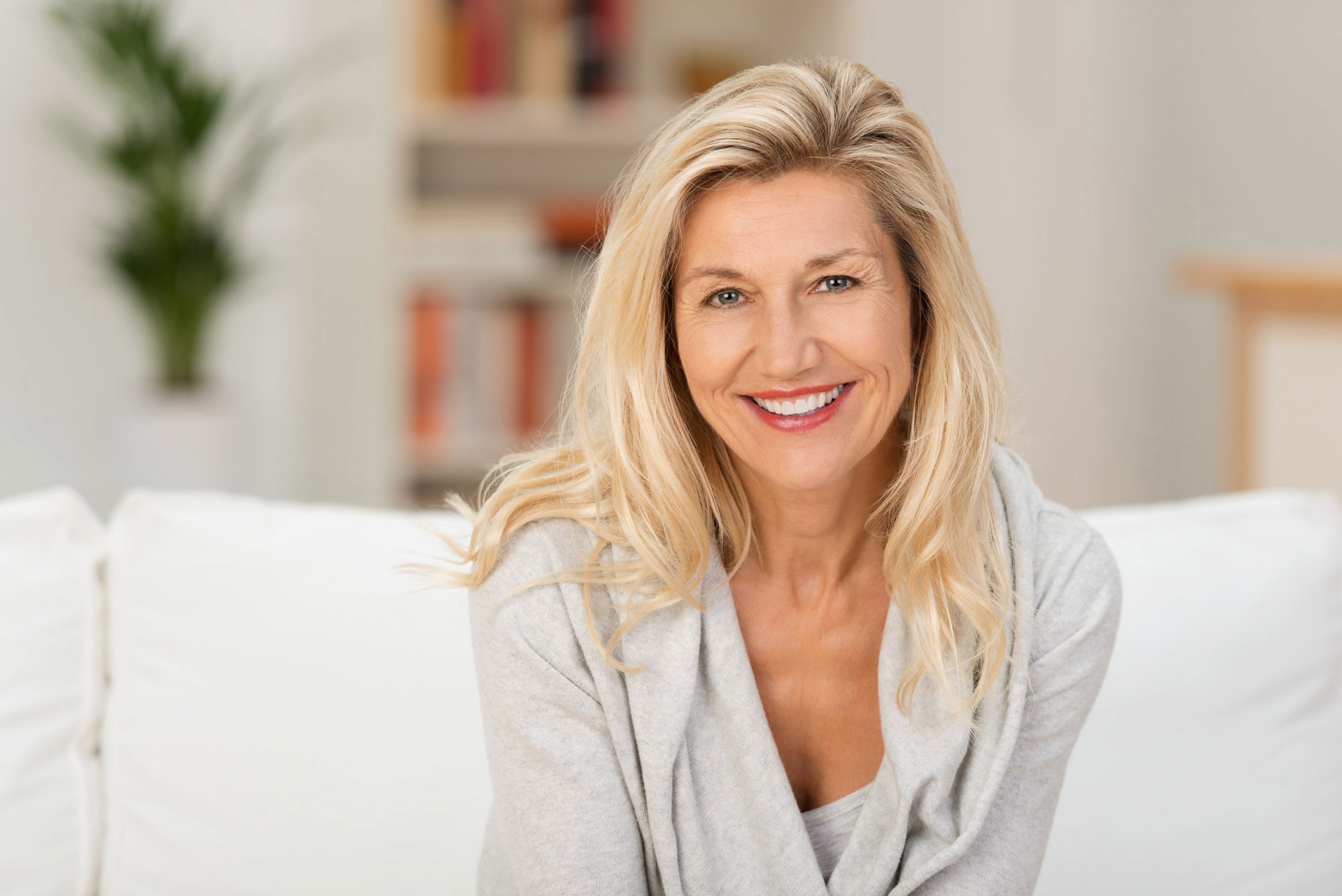 businesswoman smiling with her new teeth