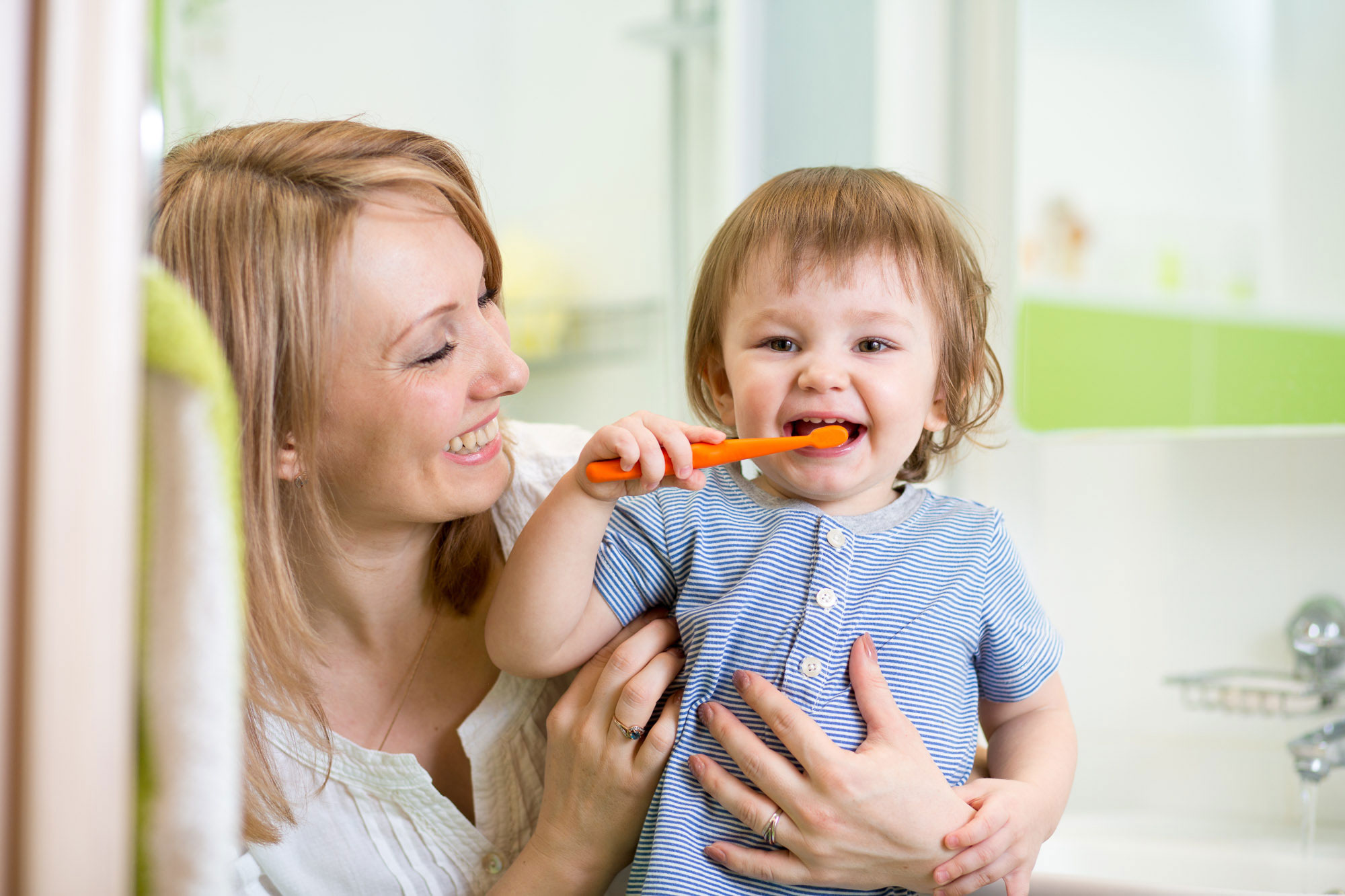 a child learning how to brush teeth