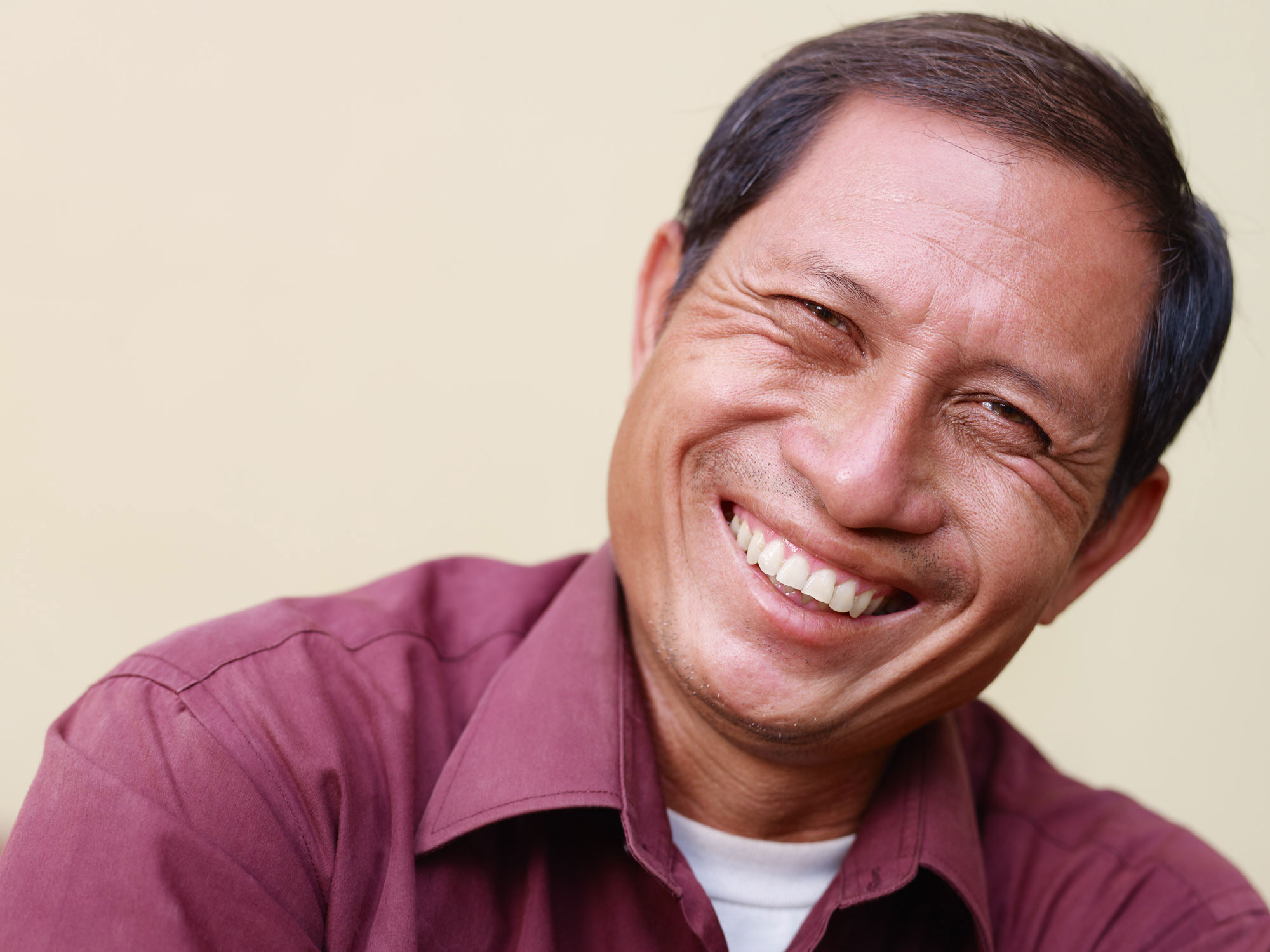 elderly man showing his partial dentures